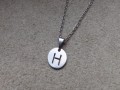 Nerezové písmeno na řetízku....